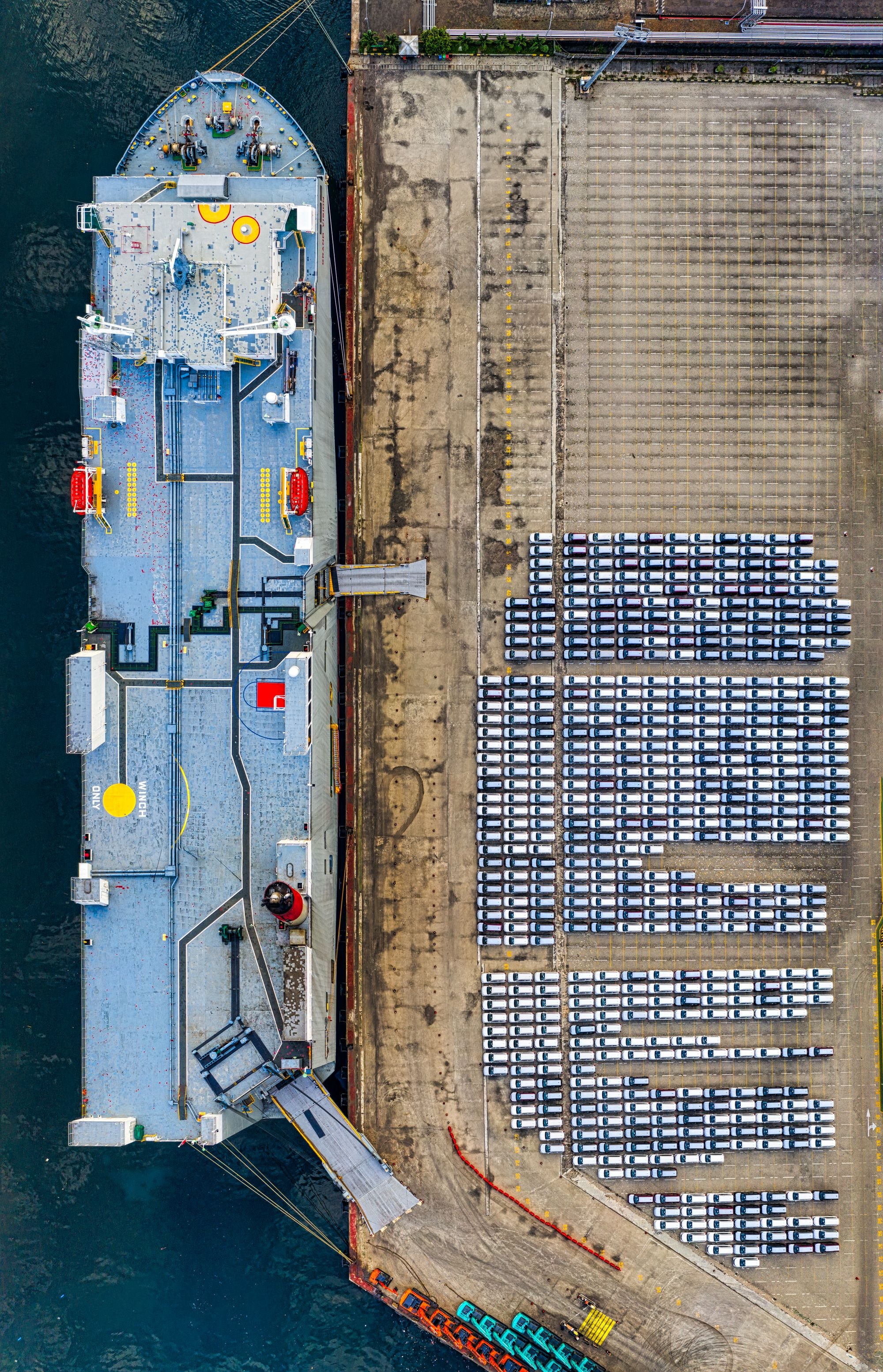 Aerial view of vehicles staged at a port loading lot