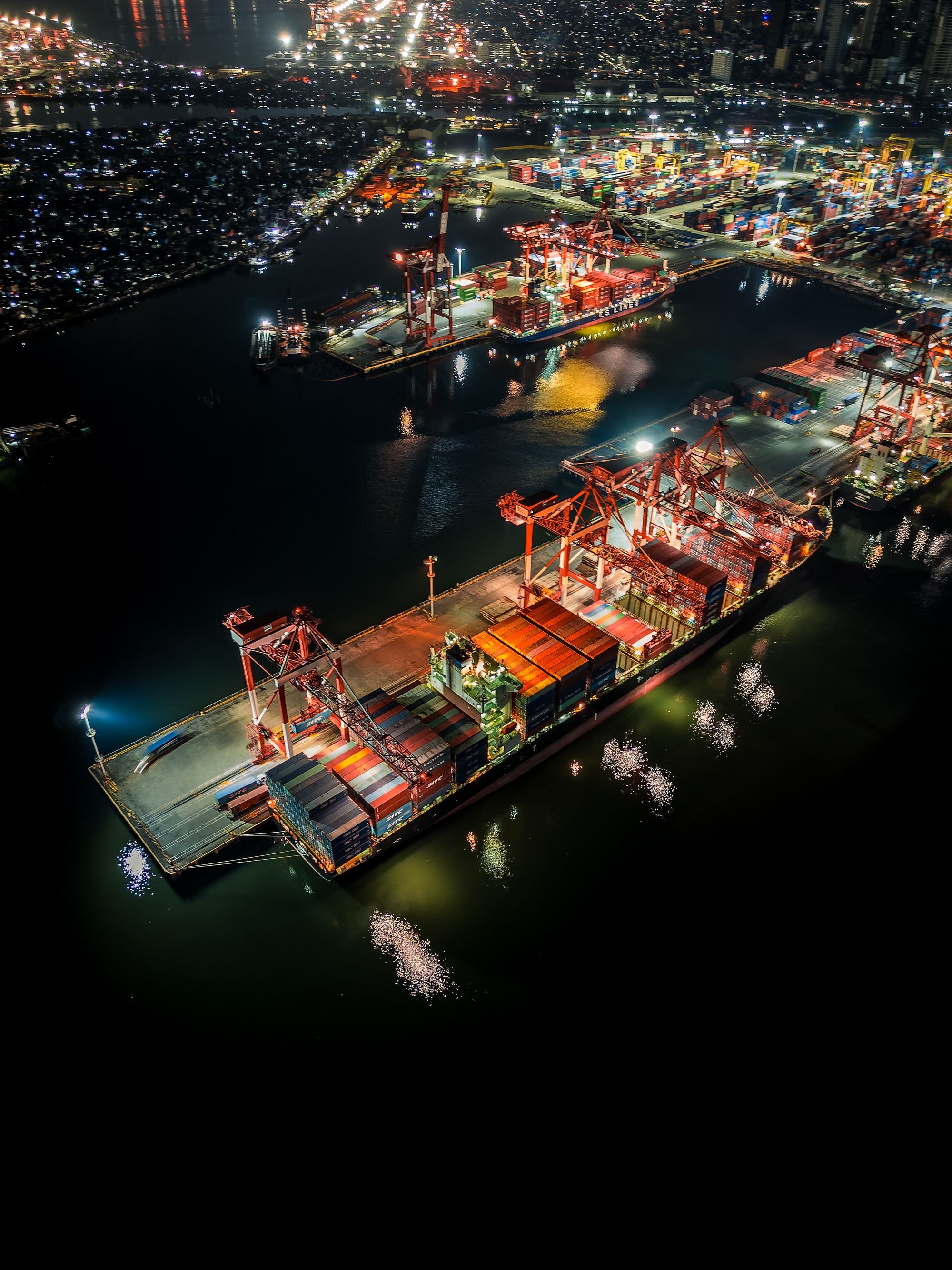 Aerial night view of an illuminated container port